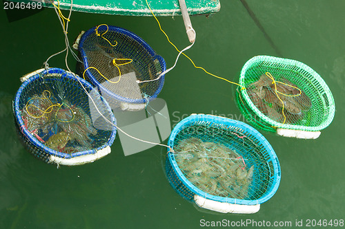 Image of HA LONG BAY, VIETNAM AUG 10, 2012 - Food seller in boat. Many Vi