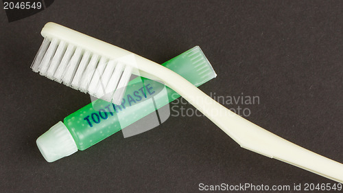 Image of Toothbrush and green toothpaste isolated