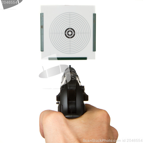 Image of Handgun aimed on a shooting target 