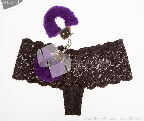 Image of Fluffy purple handcuffs and panties, prostitution