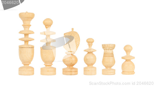 Image of Set of old handcarved chess pieces isolated