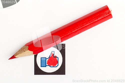 Image of Red pencil choosing the right mood, like or unlike/dislike 