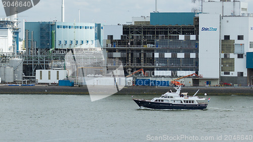 Image of Small yacht sailing through the harbor of Rotterdam (Holland)