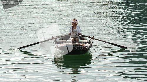 Image of HA LONG BAY, VIETNAM AUG 10, 2012 - Food seller in boat. Many Vi