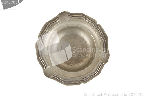 Image of Very old tin ashtray isolated