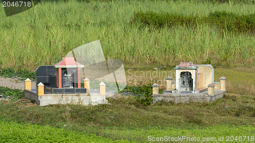 Image of Two old graves in a field