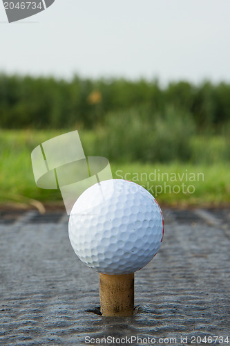 Image of Golf ball with rubber tee