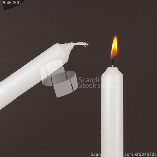 Image of Burning white candle, isolated