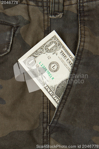 Image of Macro shot of trendy jeans with american 1 dollar bill