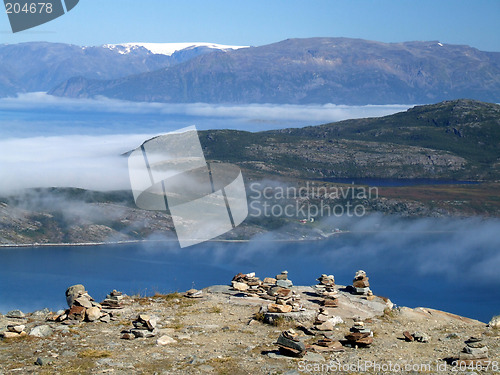 Image of Sea of clouds above an island