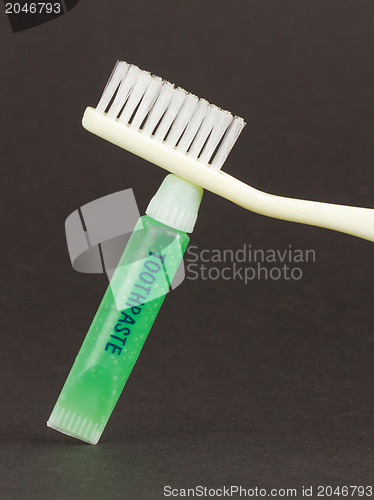 Image of Toothbrush and green toothpaste isolated