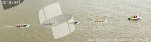 Image of Motorboat dragging some rowing-boats