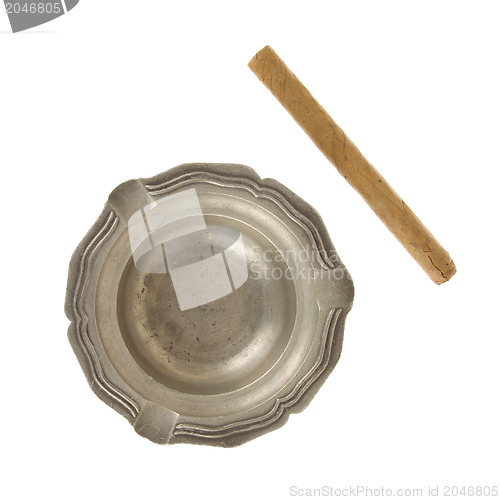 Image of Unused large cigar with an old tin ashtray