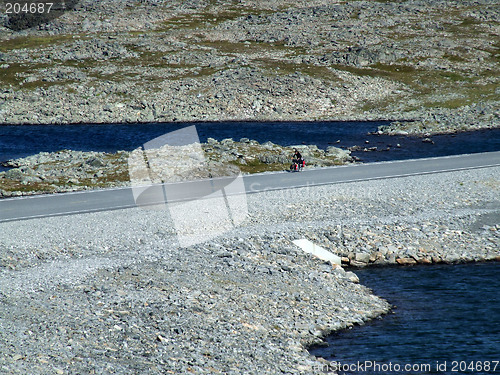 Image of Cyclist on a scenic road