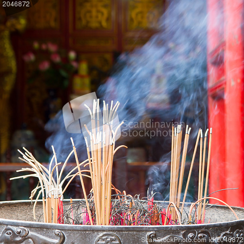 Image of Incense furnace with smoking joss stick