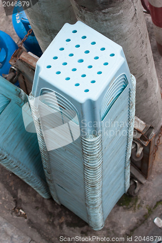 Image of Stock of blue plastic chairs, isolated