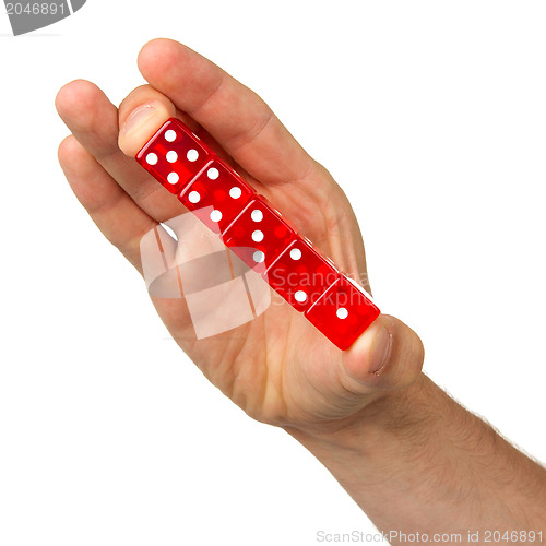 Image of Man holding five red dice