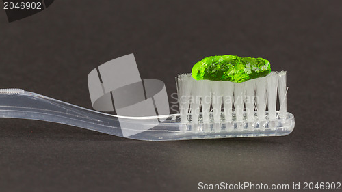 Image of Toothbrush and green toothpaste isolated