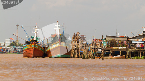 Image of Fishermen boats in a river in the Mekong Delta