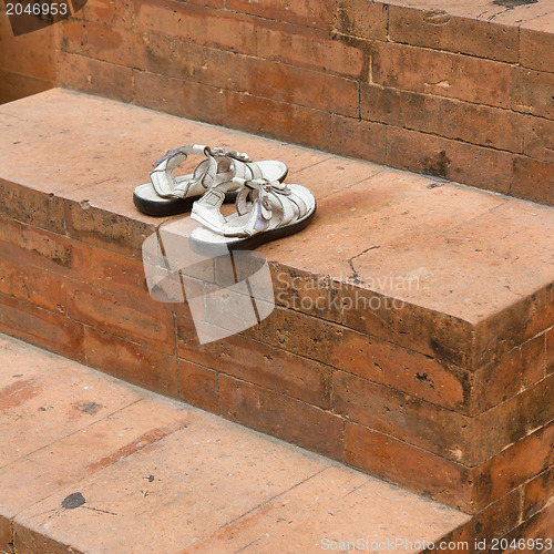 Image of Shoes at the entrance of a mosque 