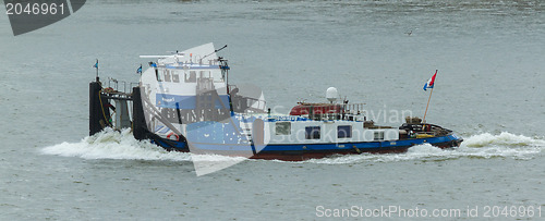 Image of Pushing boat sailing in the port of Rotterdam (Holland)