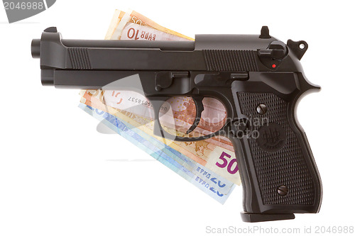 Image of Semi-automatic gun and money isolated