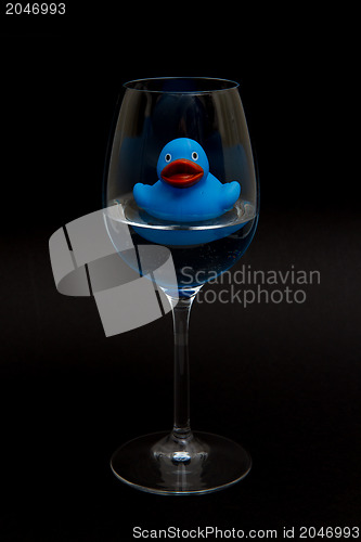 Image of Blue rubber duck in a wineglass