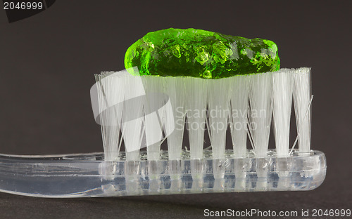 Image of Toothbrush and green toothpaste isolated