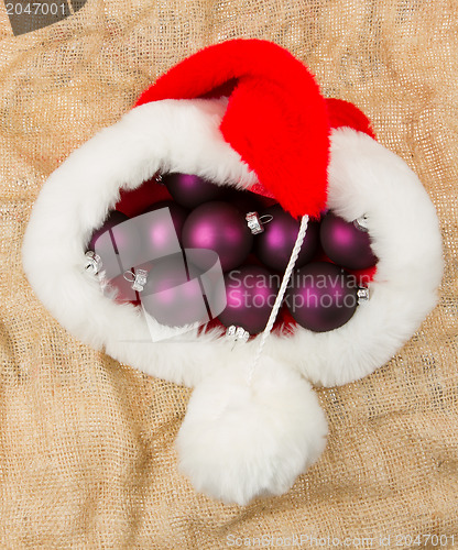 Image of Santas hat filled with Christmas balls