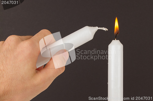 Image of Burning white candle, isolated