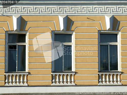 Image of Yellow windows in an old building