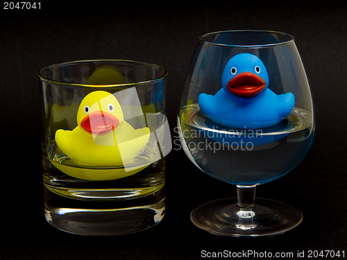 Image of Blue and yellow rubber duck in glasses