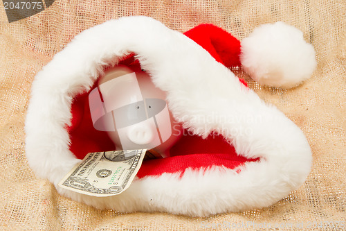 Image of Piggybank guarding Santa's crisis budget