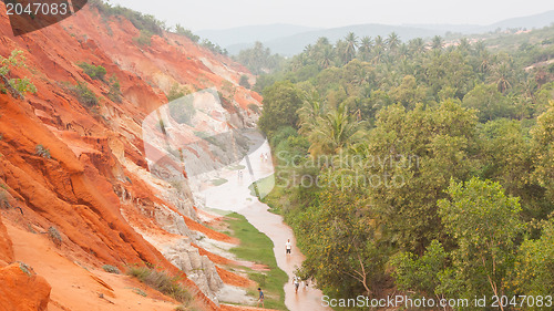 Image of Unidentified people walking through the Ham Tien canyon in Vietn