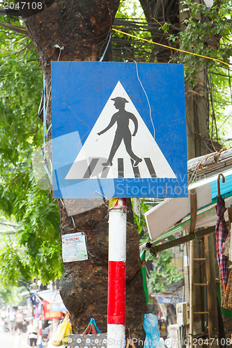 Image of Pedestrian crossing sign in the center of Hanoi