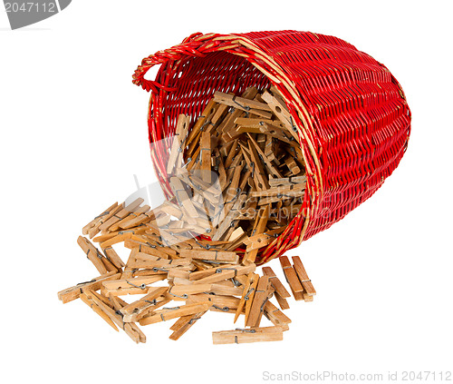 Image of Very old red basket with wooden clothespins