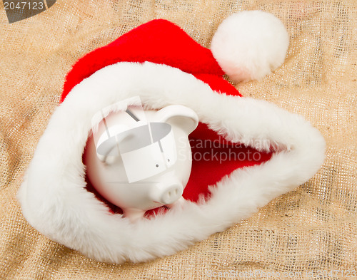 Image of Piggybank guarding Santa's crisis budget