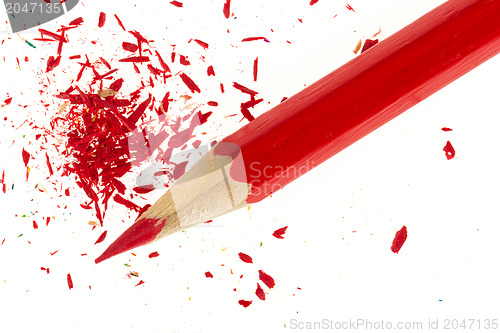 Image of Red pencil and wood shavings