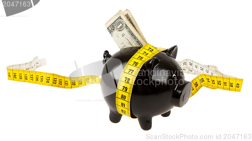 Image of Black piggy bank with measuring tape