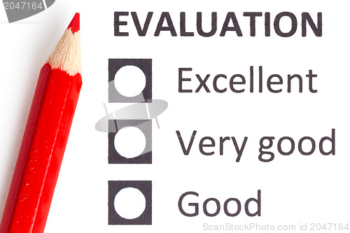 Image of Red pencil on a evaluationform