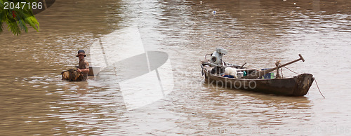 Image of HO CHI MINH CITY, VIETNAM, 23 JULY 2012; A vietnamese fisherman 