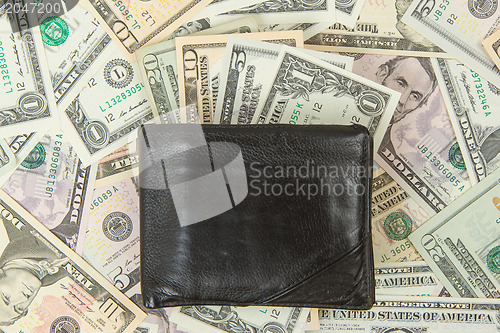 Image of Old used wallet with dollars 