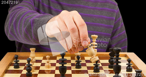 Image of Chessboard with man thinking about chess strategy, isolated
