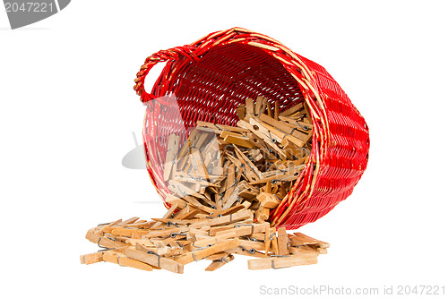 Image of Very old red basket with wooden clothespins