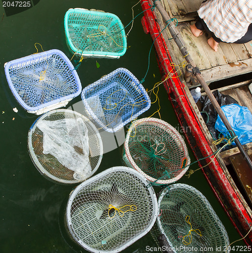 Image of HA LONG BAY, VIETNAM AUG 10, 2012 - Food seller in boat. Many Vi