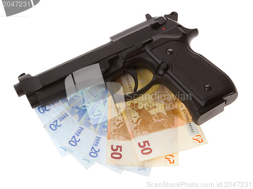 Image of Semi-automatic gun and money isolated