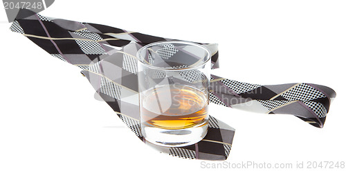 Image of Glass of whisky and a tie