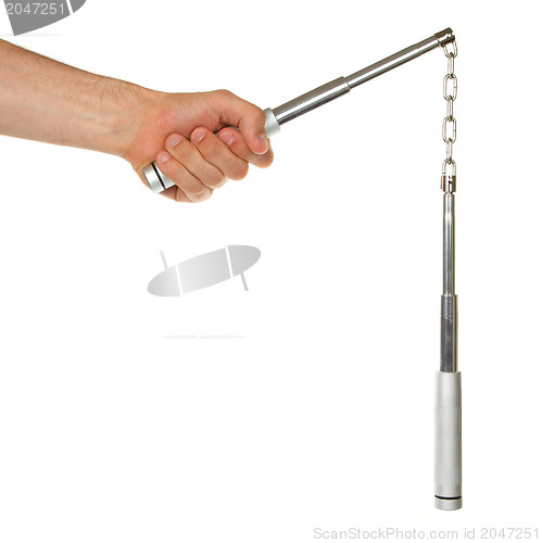 Image of Hand holding a metal nunchaku