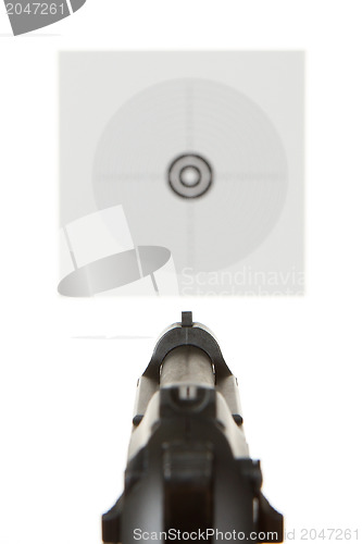 Image of Handgun aimed on a shooting target 