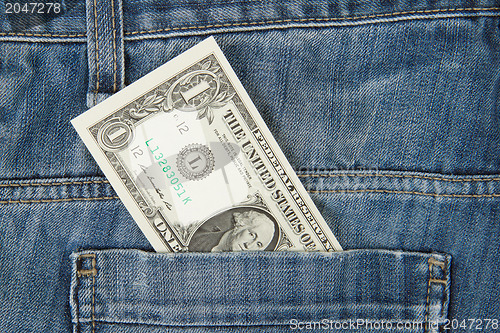 Image of Macro shot of trendy jeans with american 1 dollar bill